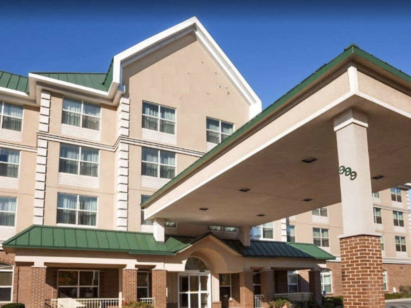 Empty hotel building sits vacant without signage