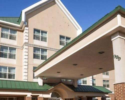 Empty hotel building sits vacant without signage Empty hotel building sits vacant without signage